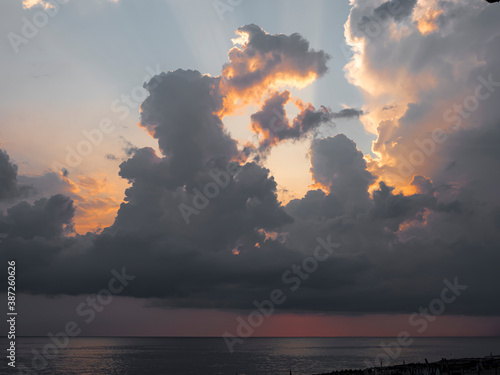 sunrise over sea dramatic big clouds