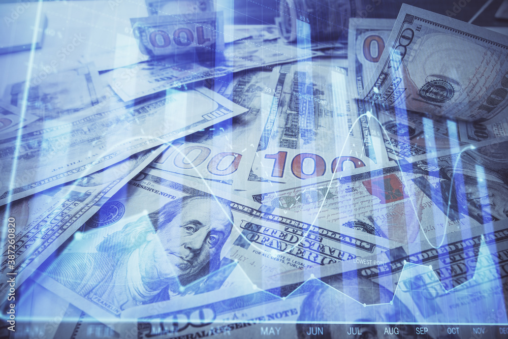 Multi exposure of forex chart drawing over us dollars bill background. Concept of financial success markets. Multi exposure of forex chart drawing over us dollars bill background. Concept of financial success markets.