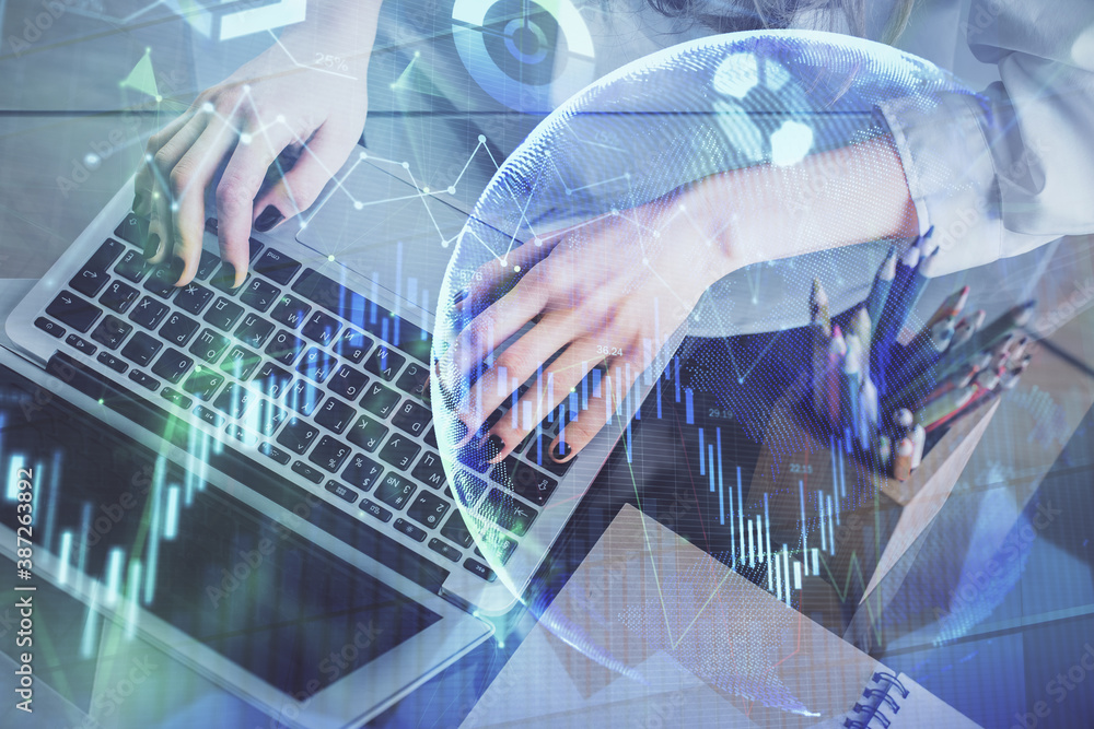 Double exposure of woman hands typing on computer and forex chart hologram drawing. Stock market invest concept. Double exposure of woman hands typing on computer and forex chart hologram drawing. Stock market invest concept.