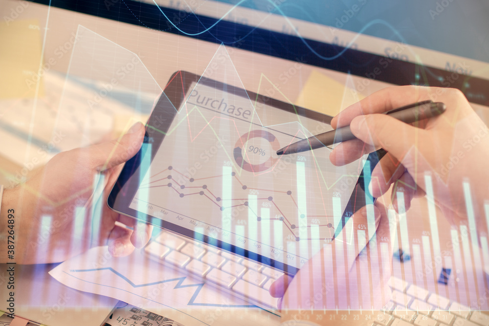 Double exposure of man's hands holding and using a phone and financial chart drawing. Market analysis concept. Double exposure of man's hands holding and using a phone and financial chart drawing. Market analysis concept.
