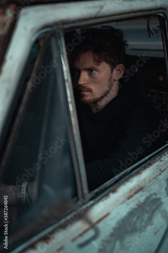 Portrait of a Guy Sitting in an Old Car © Женя Шаповалов