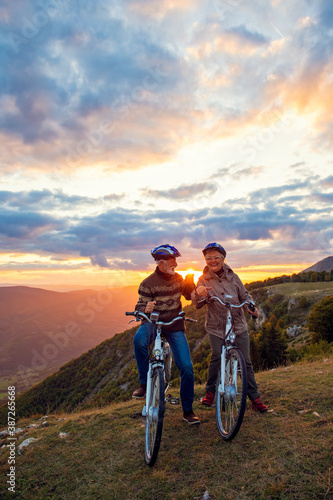 Senior Couple On Cycle Ride In Countryside