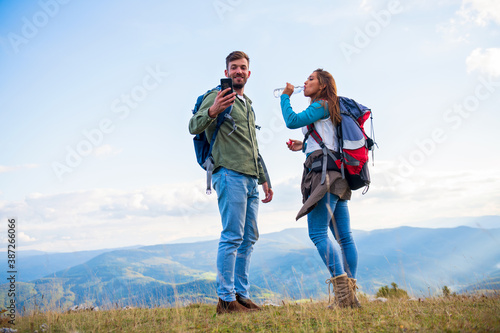 Happy Couple On A Hike Taking A Selfie