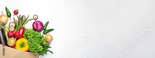 Many fresh different vegetables on light background  top view with space for text. Banner design