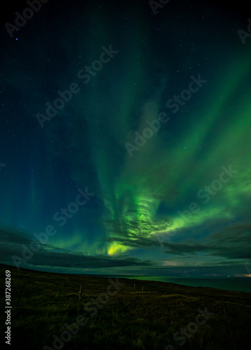 Aurora over Vestmannaeyjar taken from Storhofdi. © Fridrik