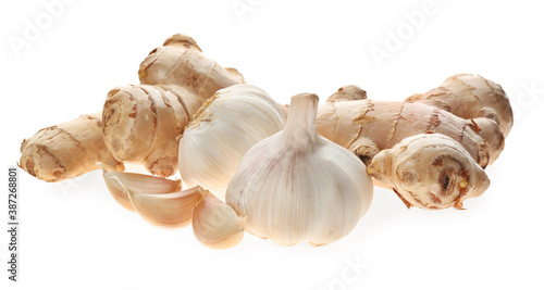 Ginger and fresh garlic on white background. Natural cold remedies