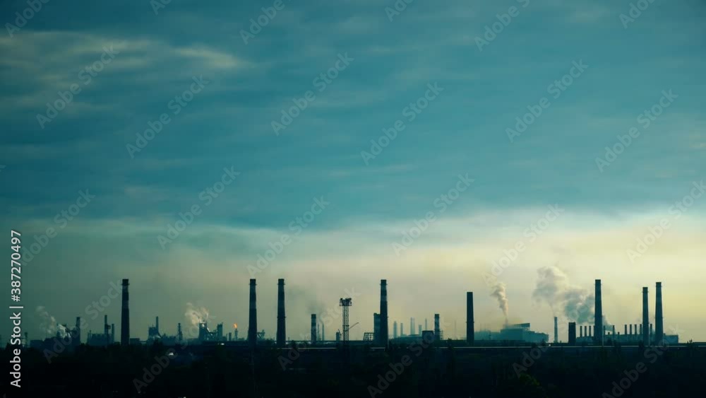 Industrial factory against the blue sky. Mining background. Metallurgical industrial factory. Poisoned air. Epic pollution of nature. Toxic substances. Industrial factory against the blue sky. Mining background. Metallurgical industrial factory. Poisoned air. Epic pollution of nature. Toxic substances.