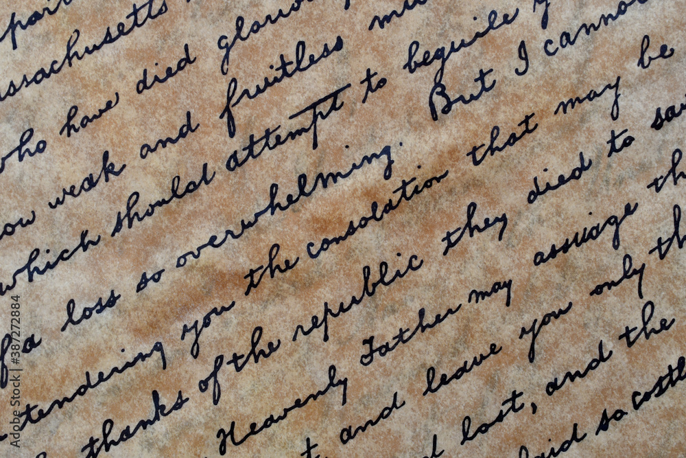 Cursive writing on parchment paper on the diagonal Stock Photo
