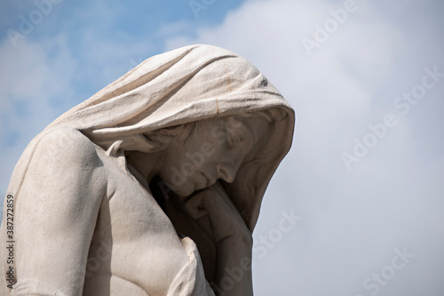 Bild auf Leinwand A statue of a mourning woman stands in front of the Vimy Ridge Canadian War Memorial in Arras, France