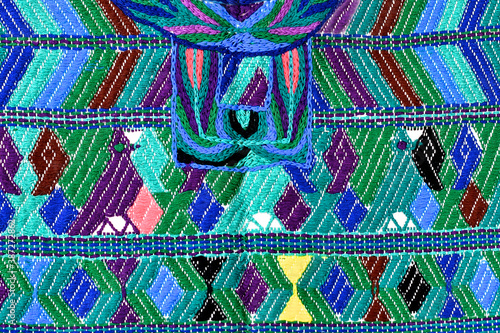 Closeup of San  Juan Cotzal huipil, Guatemala. Each region has developed their own distinct weaving patterns and color palettes for their huipiles photo