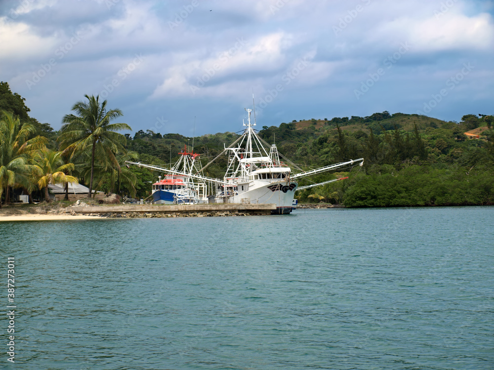 Boats docked by the side of the main harbor in Roaton, Hondurus, in the Caribbean