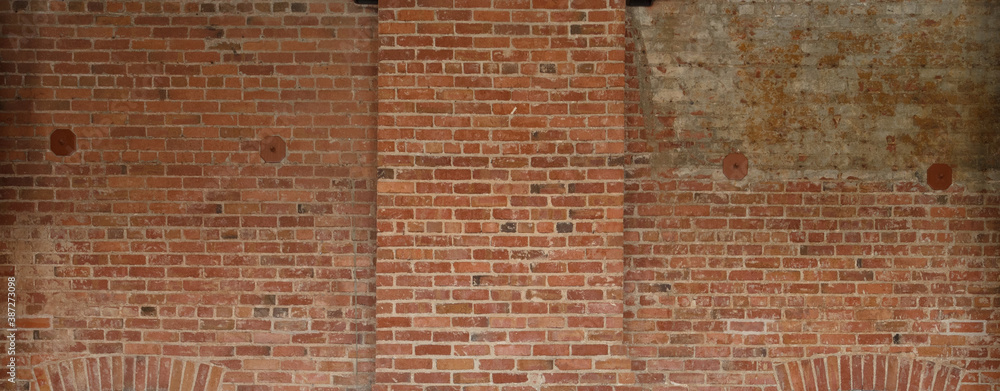 red brick wall background showing grungy texture and patchwork red brick wall background showing grungy texture and patchwork