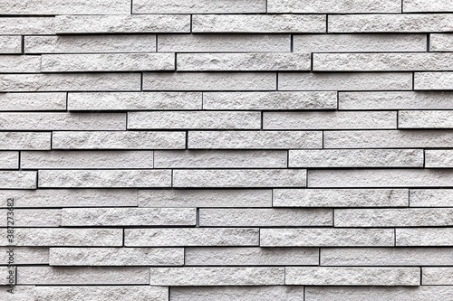 Block pattern of white stone cladding wall tile texture and seamless background