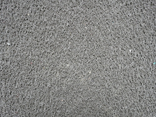 closeup of doormat texture background in front of the door.