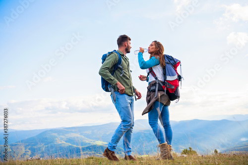 Young couple taking a break on a hike.