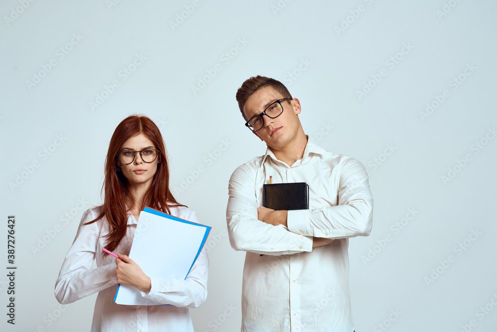 business man and woman secretary documents employees colleagues on light background cropped view business man and woman secretary documents employees colleagues on light background cropped view