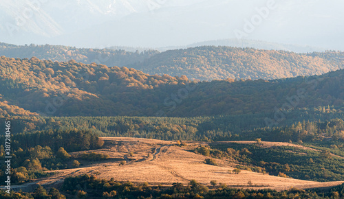 clear blue air over mountains in bulgaria crops hay fields clouds blue sharp focus distance superzoom copy space for text minimal landscape rural