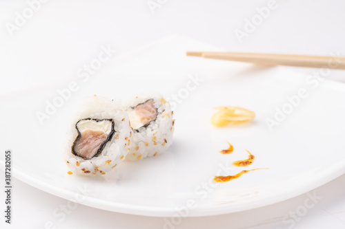 urakami style sushi roll on white plate and white background