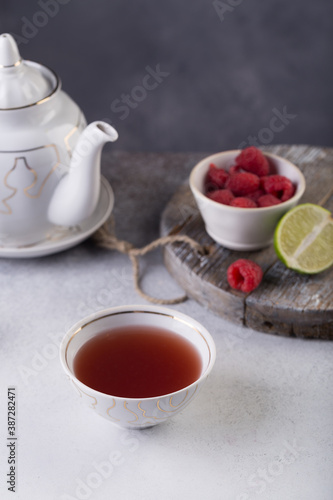 Morning fresh tea with wild berries and lime. Concept. High quality photo