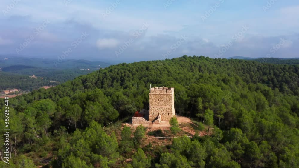 aerial drone shot of soldiers tower in avinyó dense natural green forest. mountains of catalonia spain. aerial drone shot of soldiers tower in avinyó dense natural green forest. mountains of catalonia spain.