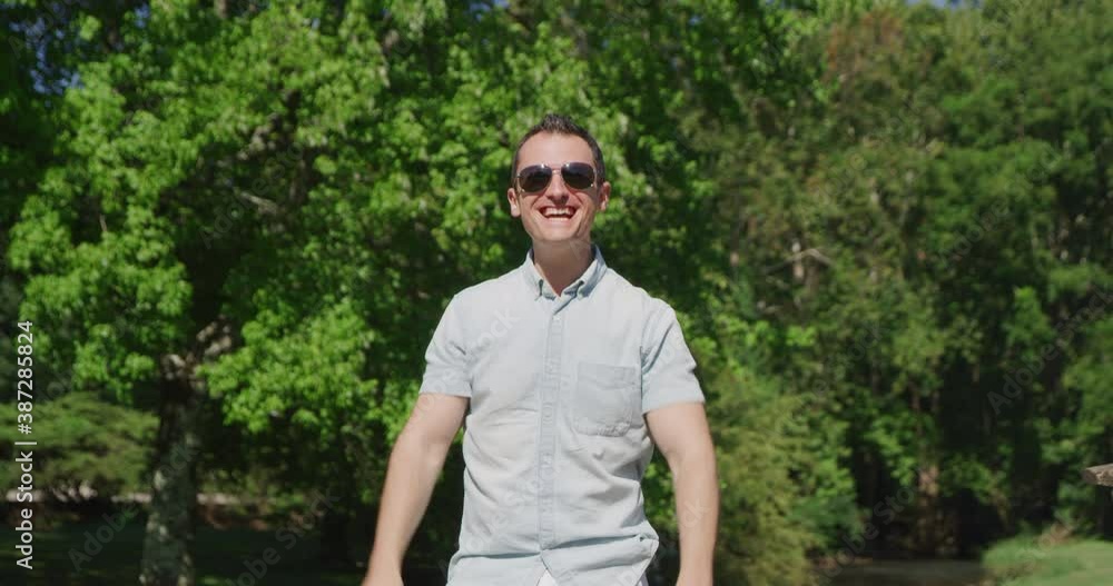 Young pretty man is singing and dancing in summer park 4k Young pretty man is singing and dancing in summer park 4k