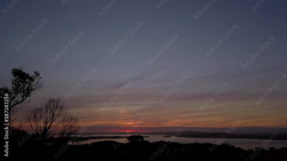 Panning right viewing beautiful sunrise sunset over the hill Panning right viewing beautiful sunrise sunset over the hill