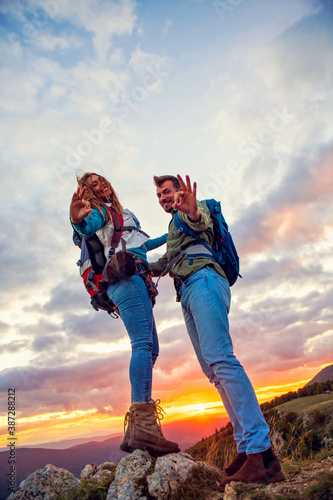 Couple on Top of a Mountain showing thumbs up