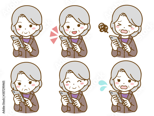 スマホを操作するスーツの老年女性