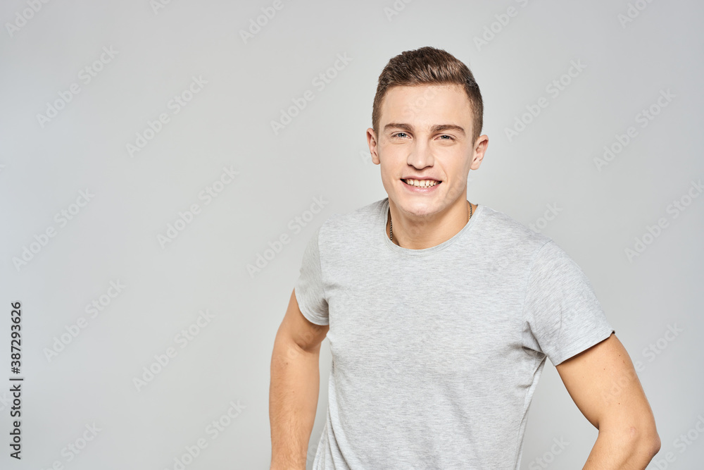 handsome man in light t-shirt cropped view emotion studio isolated background handsome man in light t-shirt cropped view emotion studio isolated background