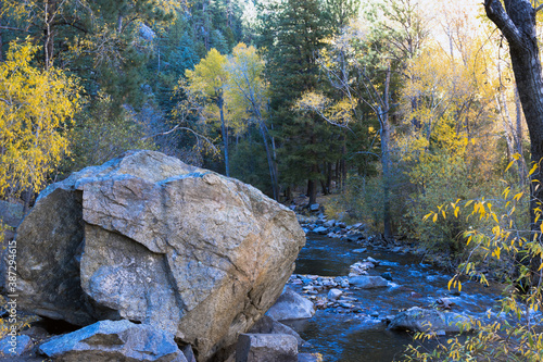 Pecos River in autumn in the Santa Fe National Forest of New Mexico is a great place to hike along the water and beautiful rocks photo