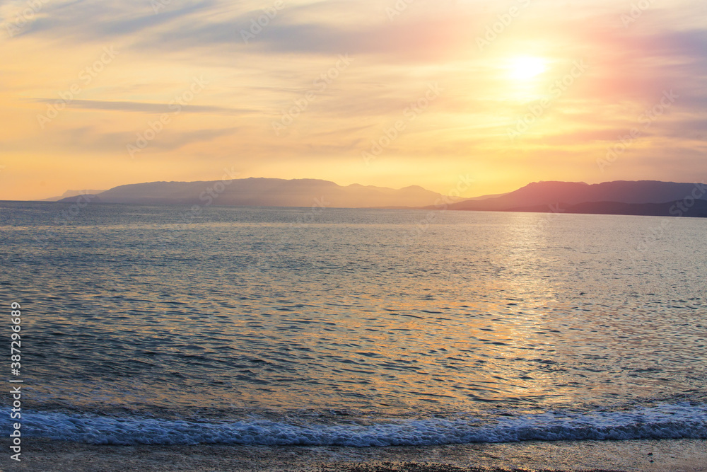 Sunset over the Mountains on the Seashore Sunset over the Mountains on the Seashore