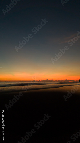 Beautiful Sunset with nice sky on black sand beach © Nut