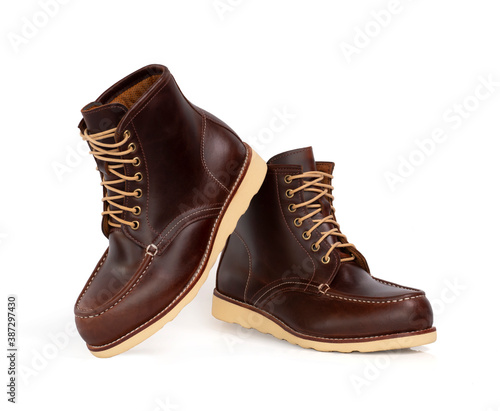 Men fashion leather brown boots isolated on white background.