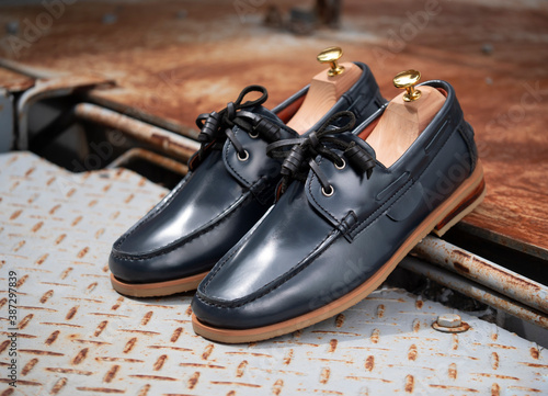 Men fashion boat shoes leather with shoe tree (shape supporter) on steel plate.