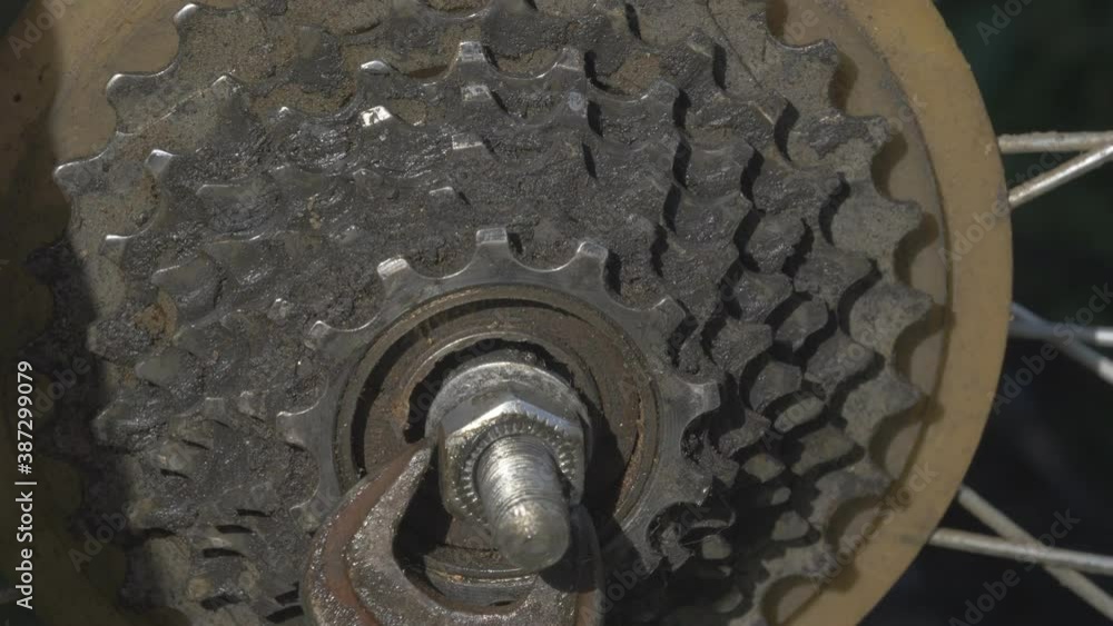 Man Turns Bicycle Wheel Axle Nut. Man Turns Bicycle Wheel Axle Nut.