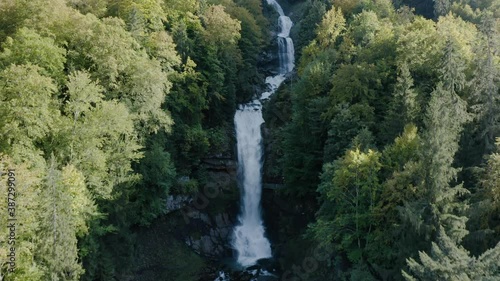 Flying Towards The Majestic Giessbach Waterfall In Brienz, Switzerland During Autumn - aerial drone photo