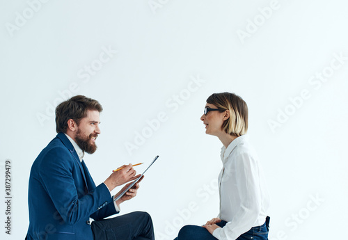 Emotional woman and young man communication on a light background psychology understanding