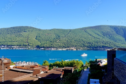 Beautiful panoramic landscape on the emerald bay of the Aegean Sea with green hills, eucalyptus, snow-white yachts. Luxury relax tourism conception, Lujo hotel Bodrum