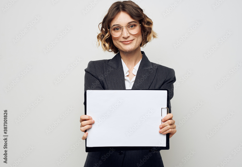 Woman in business suit with white sheet of paper at work glasses mockup Woman in business suit with white sheet of paper at work glasses mockup
