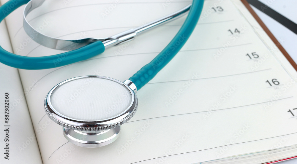 Stethoscope on a notebook, Concept of medicine and health insurance. Stethoscope on a notebook, Concept of medicine and health insurance.