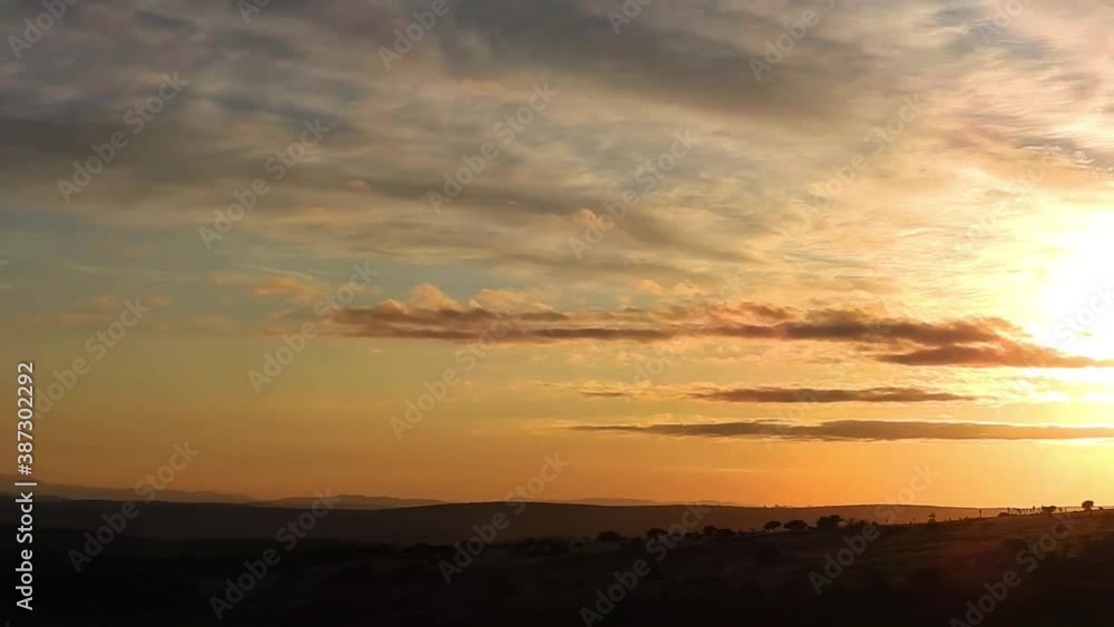 Panning of an african sunrise on an african farm with clouds in the sky Panning of an african sunrise on an african farm with clouds in the sky