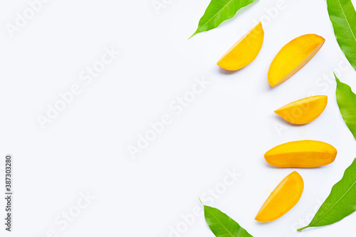 Tropical fruit  Mango  slices with leaves on white background.