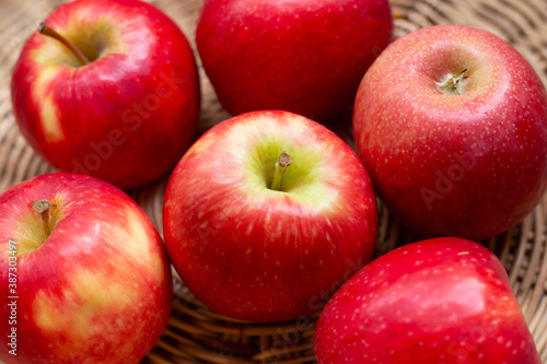 Juicy red apples in a basket