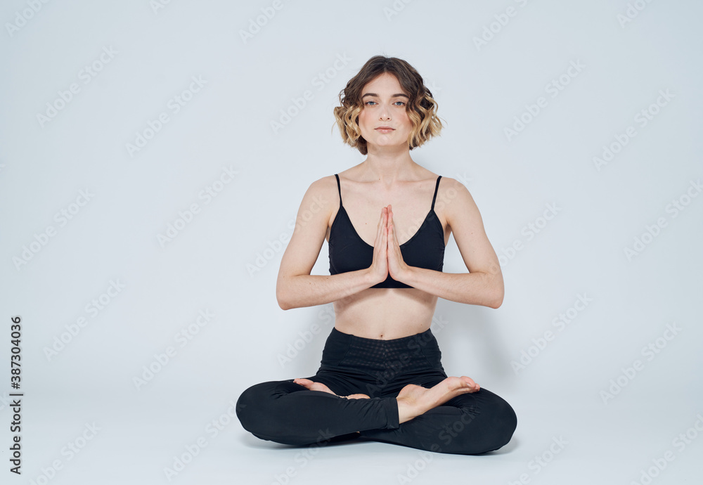Woman meet legs sitting on the floor meditation yoga asana Woman meet legs sitting on the floor meditation yoga asana
