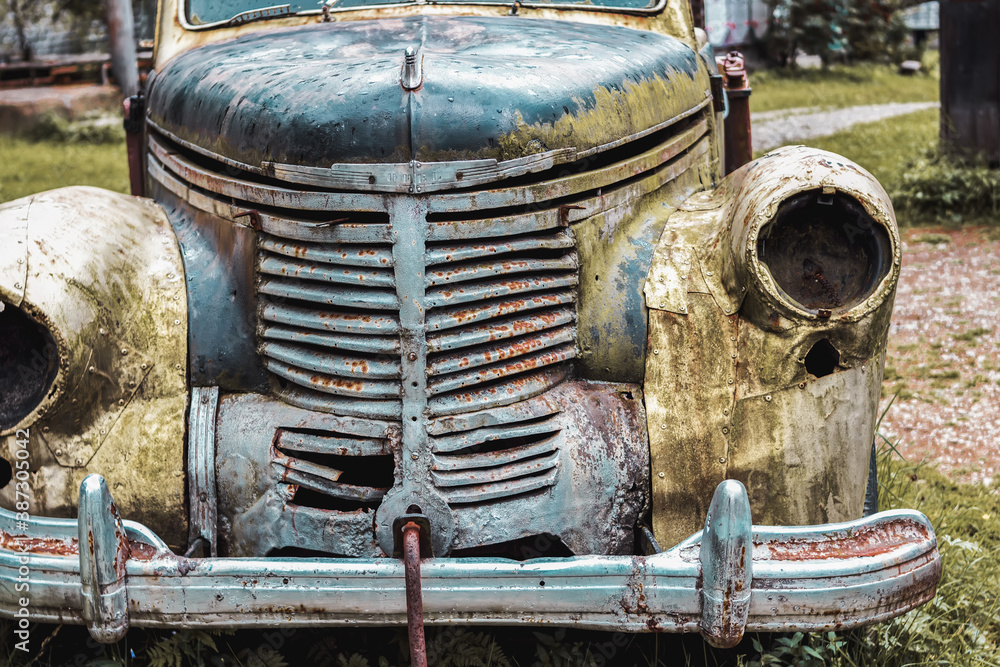 Fototapeta premium An old rusty car will never go anywhere. The concept of an old technique that has served its time.