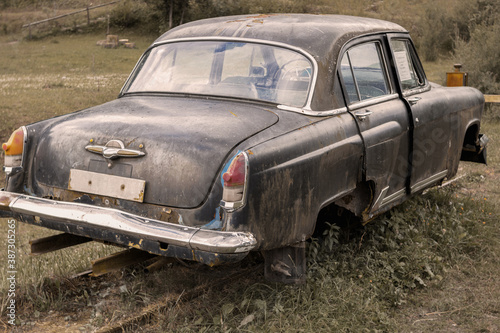 Old passenger car made in the USSR converted for movement by rail. An example of backward technology.