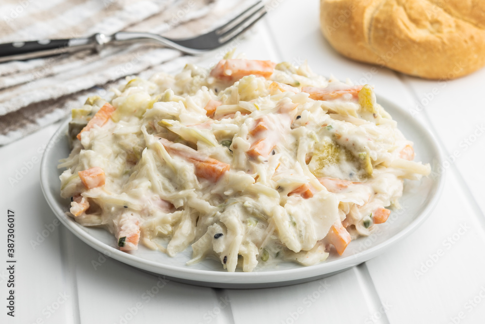 Coleslaw. Salad made of shredded white cabbage and grated carrot with mayonnaise.
