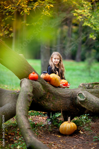 girl dressed as witches in the park during halloween