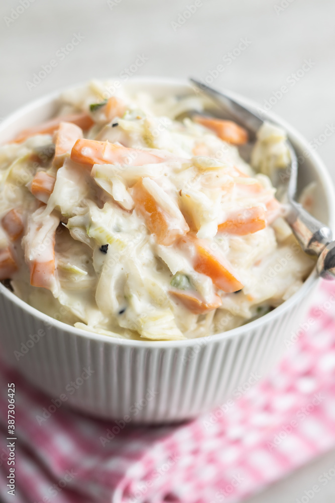Coleslaw. Salad made of shredded white cabbage and grated carrot with mayonnaise. Coleslaw. Salad made of shredded white cabbage and grated carrot with mayonnaise.