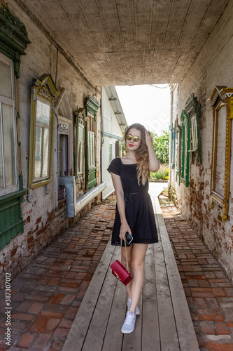 Russia, Yuryev-Polsky. Beautiful girl tourist visits the sights.
